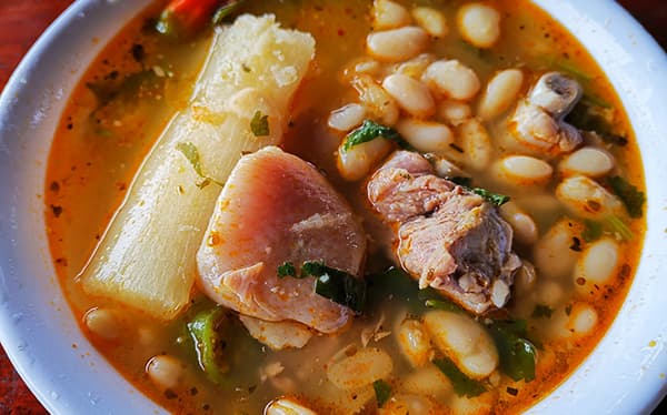 Patas de chancho con frijoles blancos — humble, rich, and deeply, deeply Tico. (Trust us, it tastes even better than it looks.)