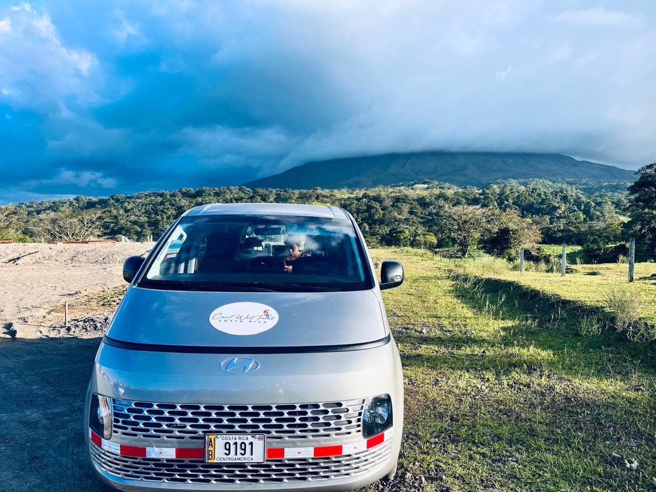 Can't Wait Travel van with Arenal Volcano in the background