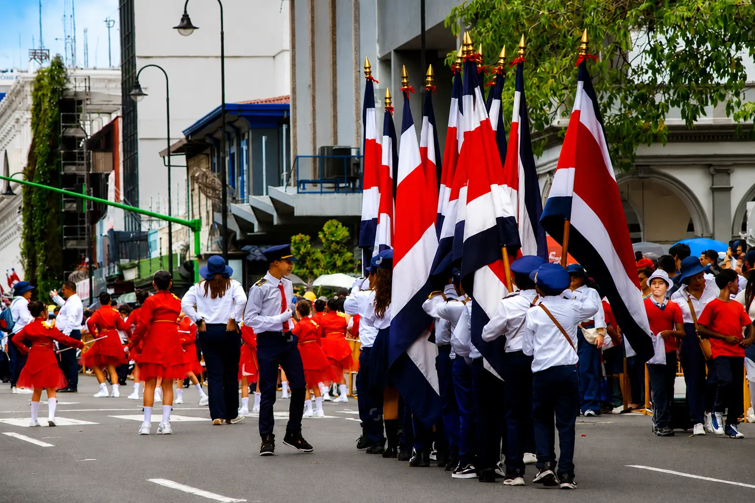 School bands march through the center of town on the morning of September 15. Most main streets are closed to traffic while they do.